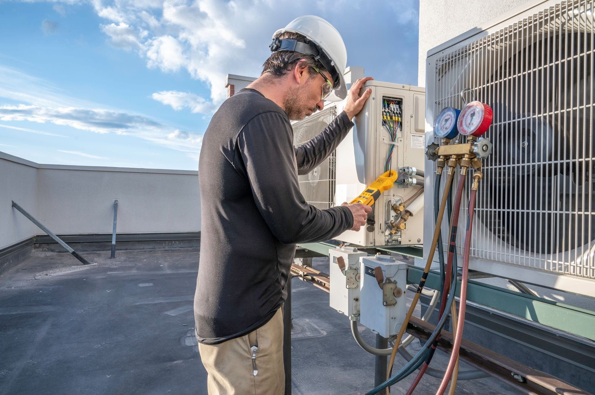 Technician Fixing The Airconditioning Unit Outdoors